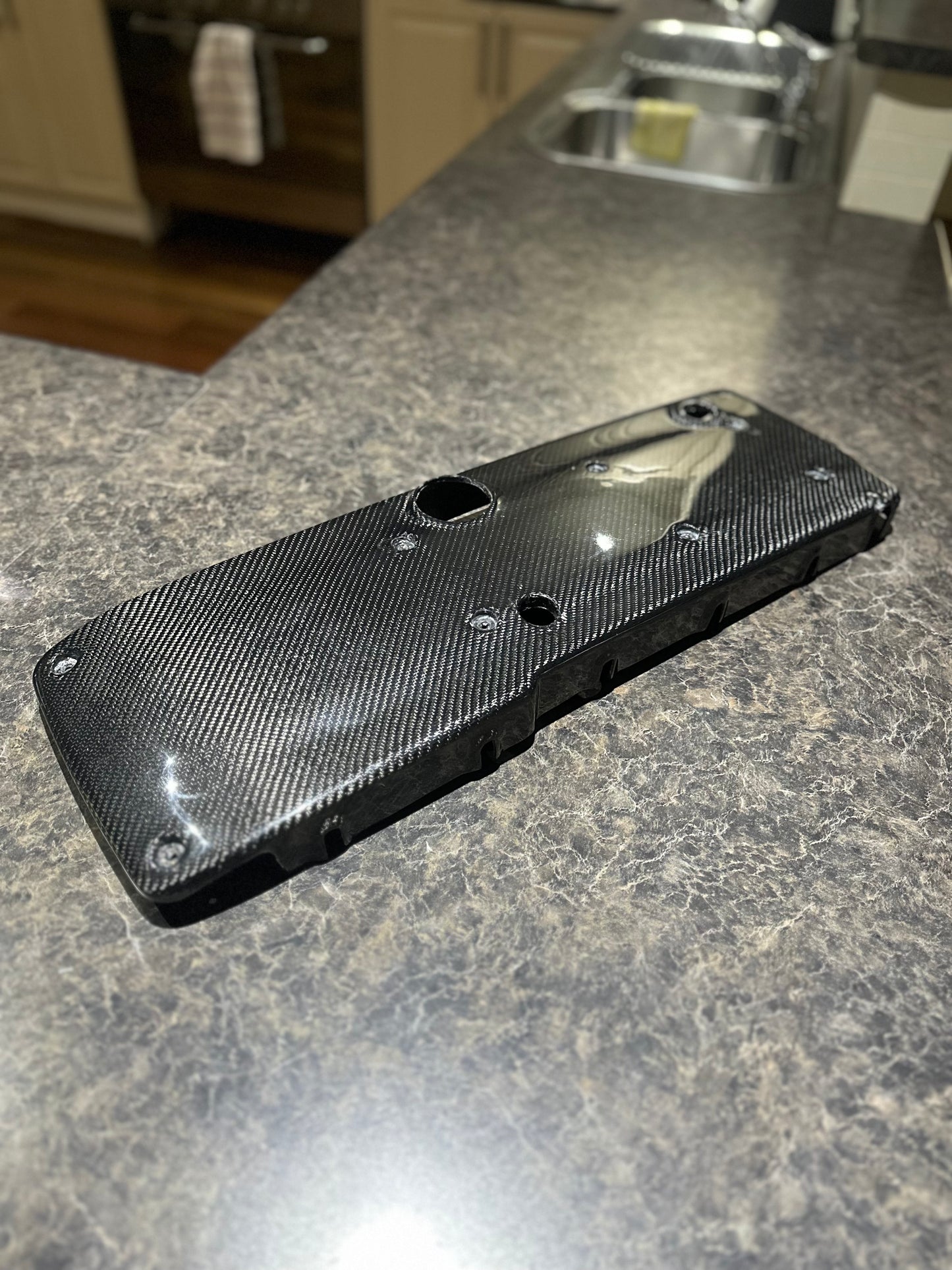 FG Falcon woven twill coil cover showing premium carbon fiber craftsmanship