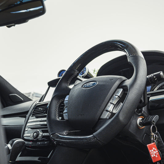 In car view of carbon fibre steering wheel for Ford Falcon FG and FGX